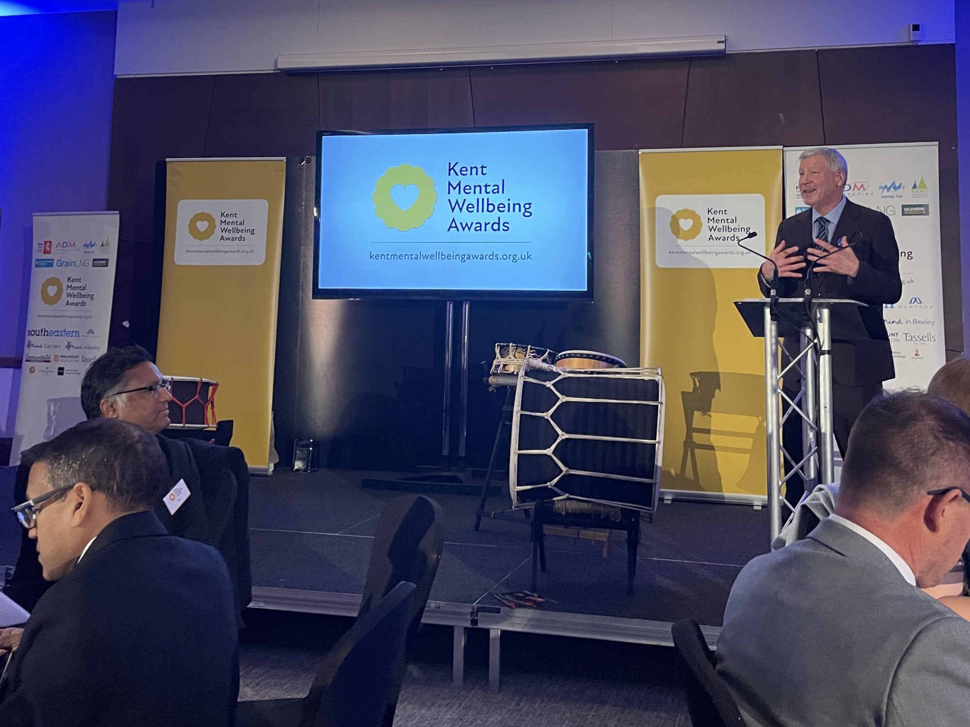 Simon Dolby stood at the lecturn and introducing tonight Kent Mental Wellbeing Awards