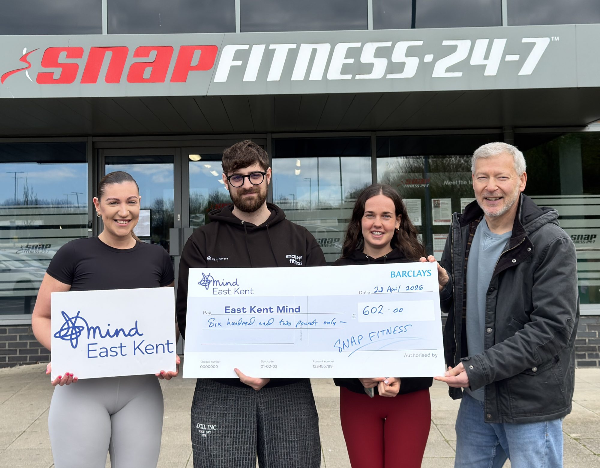 Molly Gosling and staff from Snap Fitness present a cheque to East Kent Mind Development Lead Simon Dolby