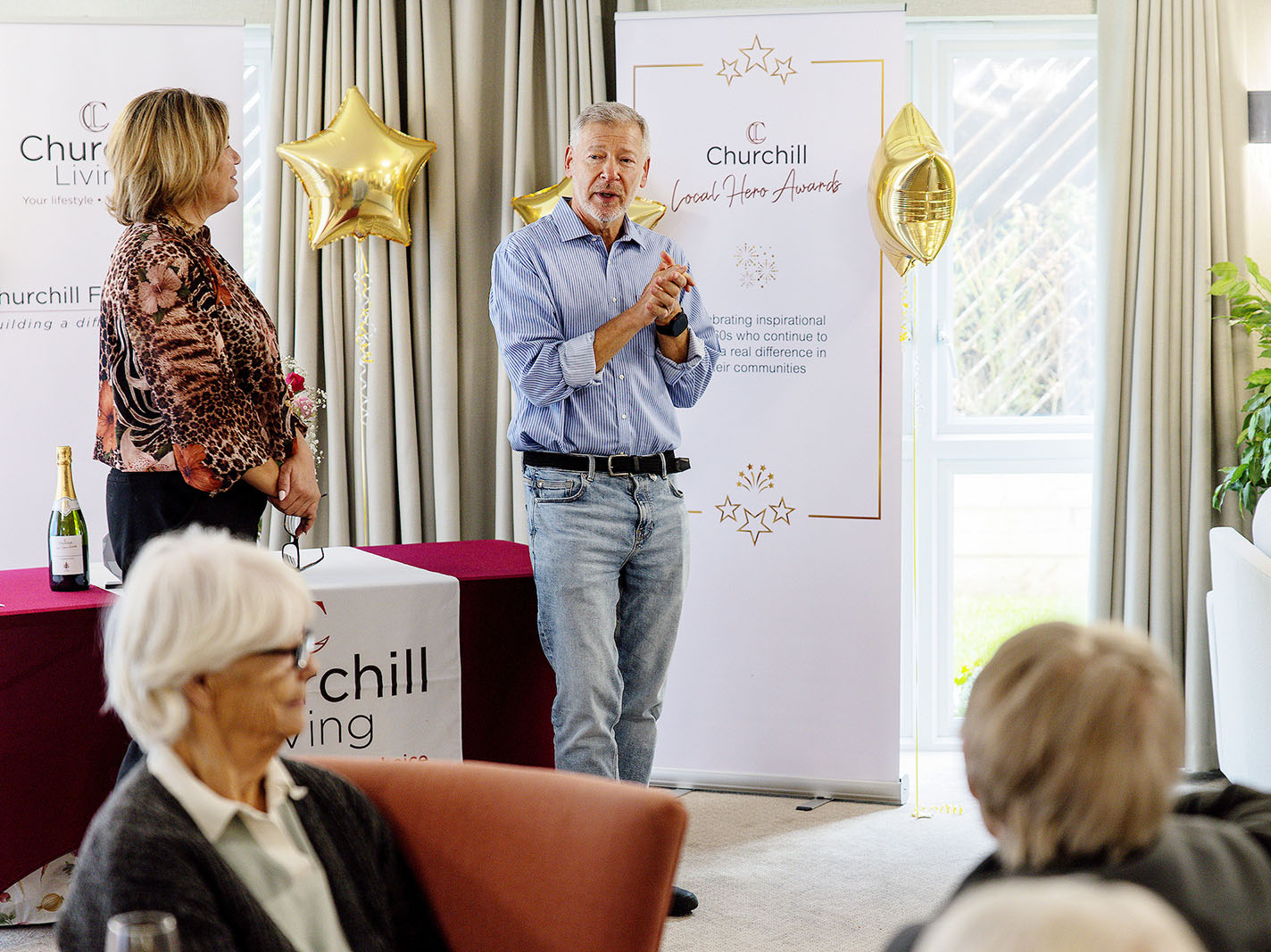 Simon Dolby talking on stage at the Churchill Living awards